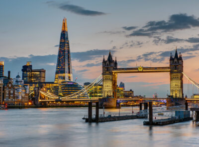 The Tower Bridge in London after sunset with the Shard in the ba